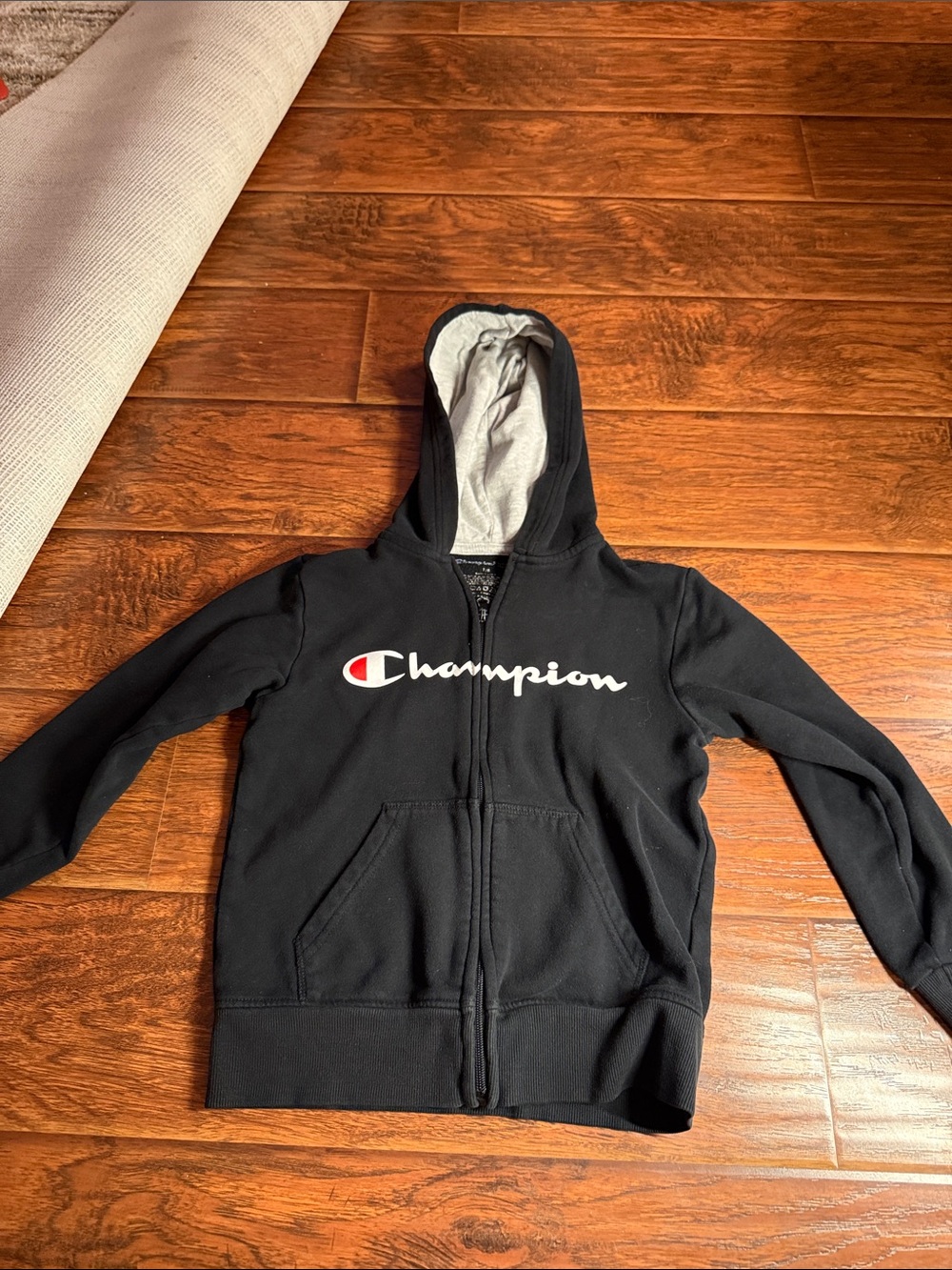 Champion Black Kids Full-Zip Hoodie with Logo. 7/8 youth in great condition
